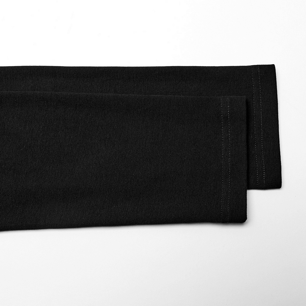 Close-up of black long sleeve top with clean edges and stitching details for a sleek, alternative fashion style.
