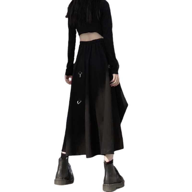 Back view of a punk style irregular black skirt with buckles, paired with a cropped top and platform boots.