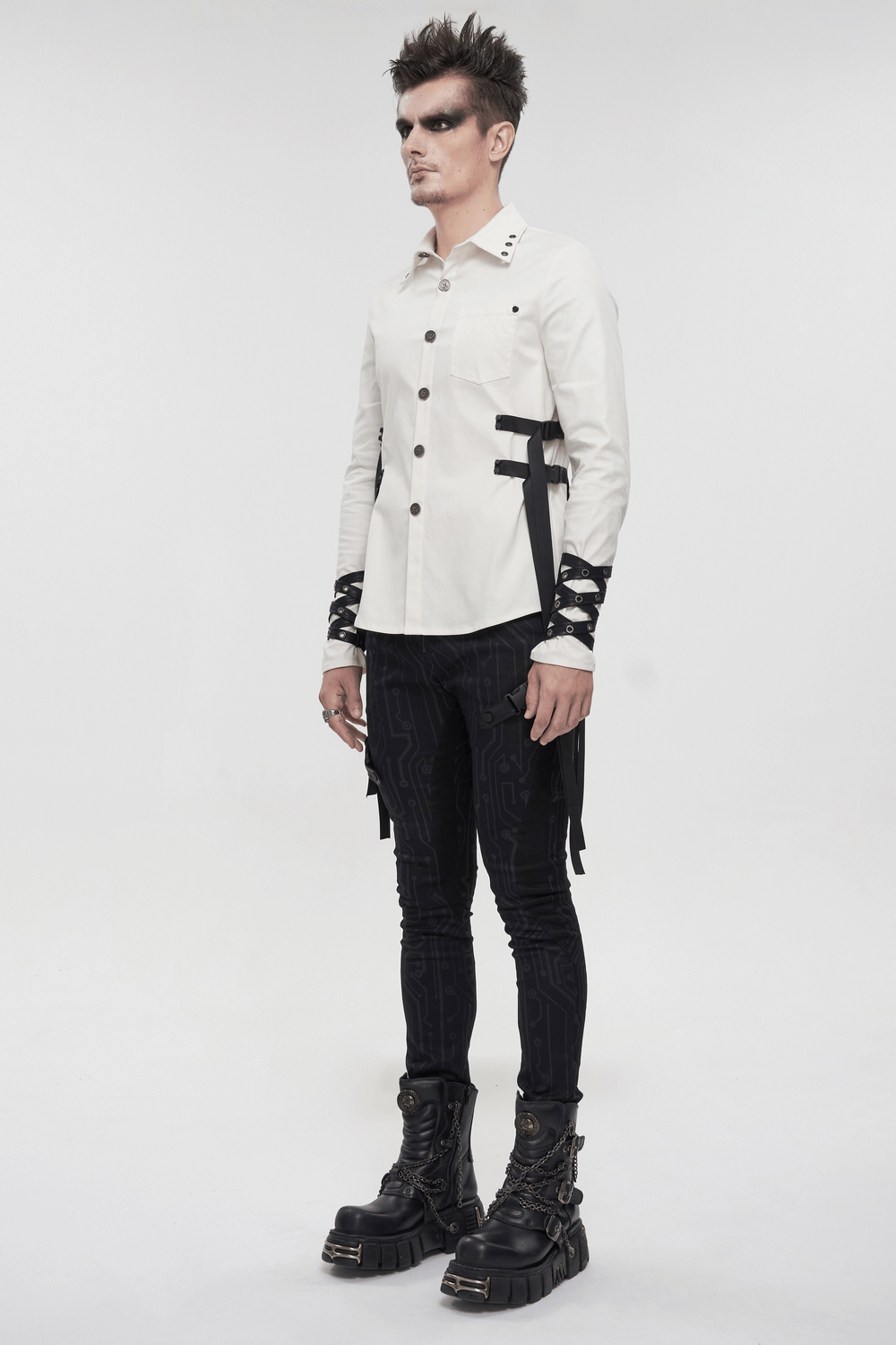 Punk style men's white long sleeve shirt with nylon straps and buckles, paired with stylish black pants and boots.