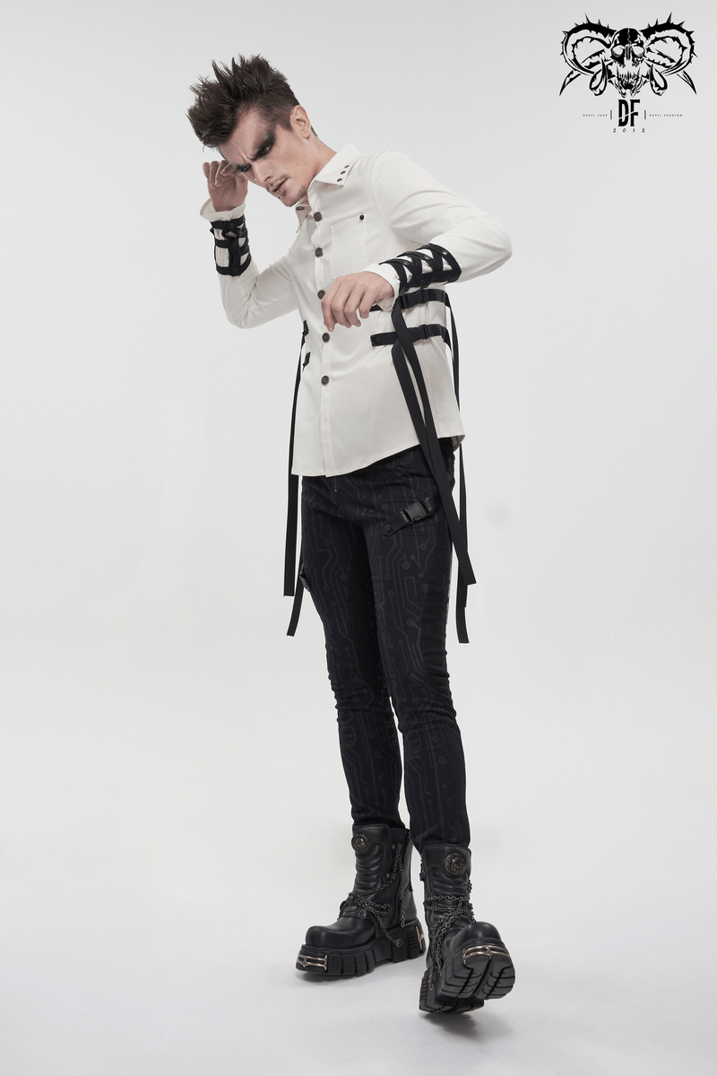 Punk style men's white long sleeve shirt with nylon straps and buckles, modeled with stylish black pants and chunky boots.