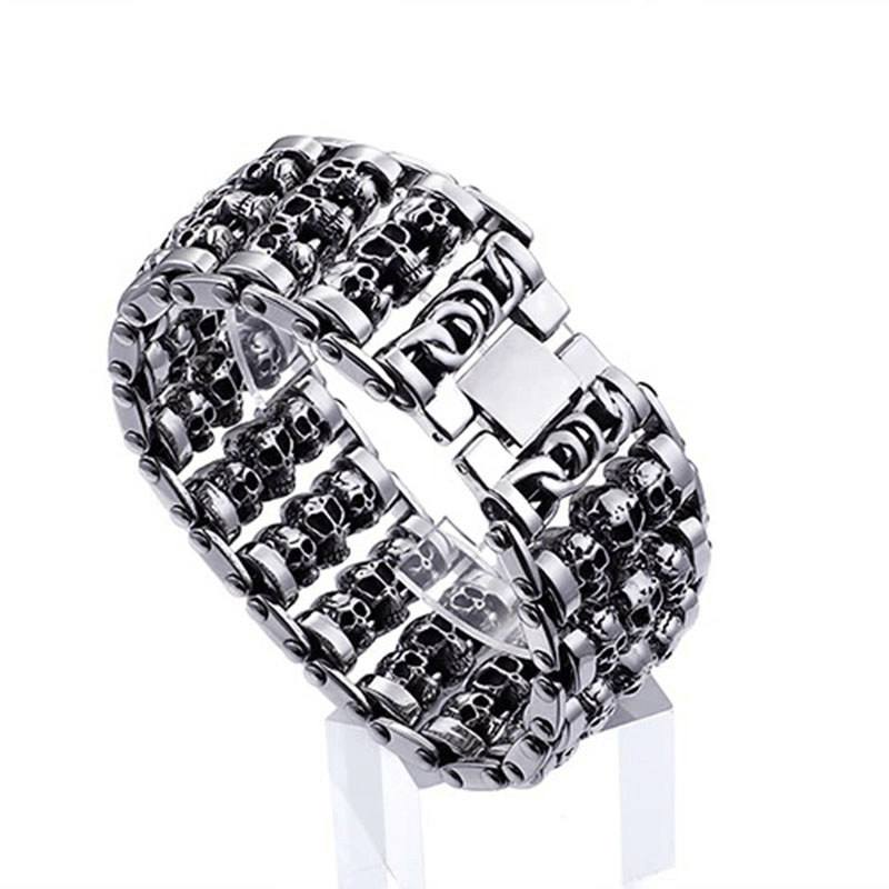 Punk style men's bracelet featuring multiple skulls in stainless steel, stylish and trendy accessory for bold fashion.