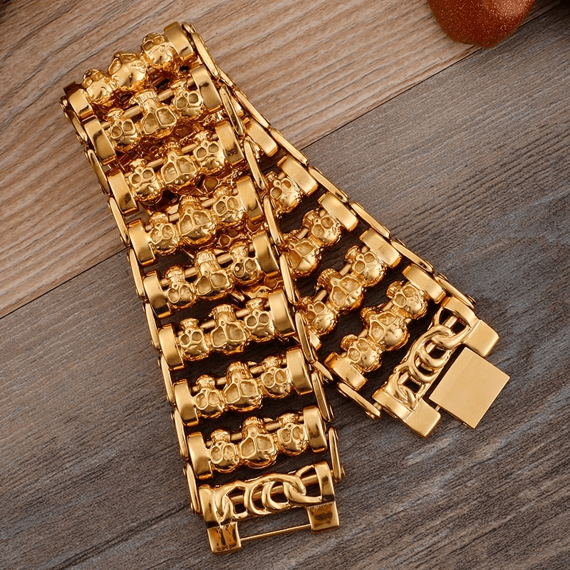 Gold punk skull charm bracelet for men, featuring multiple skull heads in a trendy stainless steel design.