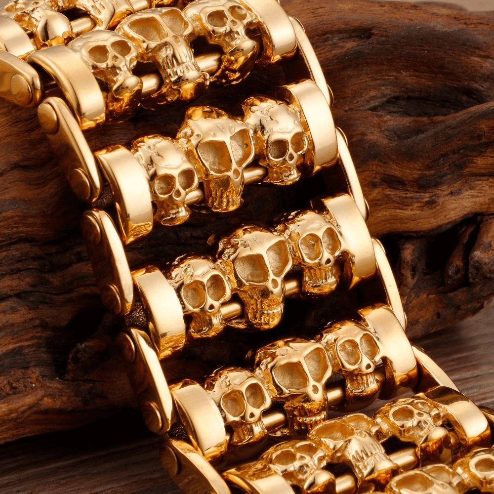 Punk style gold skull charm bracelet made of stainless steel, featuring multiple skull designs for men.