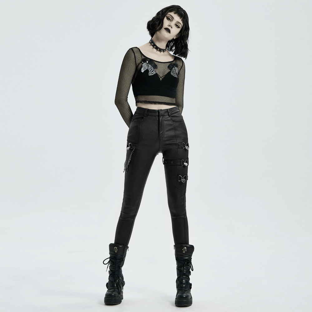 Punk-style PU leather pants with chain accents paired with a mesh crop top, featuring a rebellious silhouette and edgy look.