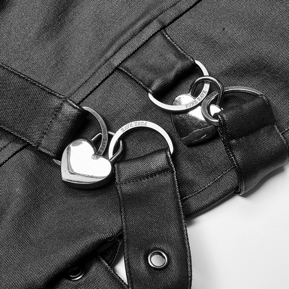 Close-up of punk-style PU leather pants featuring heart-shaped lock accents and chain details.