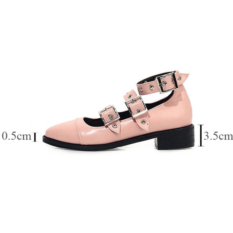 Punk style pink PU leather pumps with buckle straps, edgy alternative fashion footwear for women.
