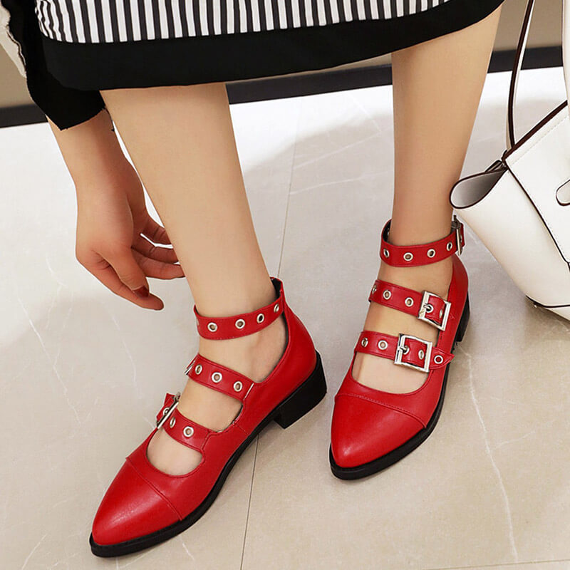 Bold red punk-style PU leather pumps with buckle straps, perfect for making a rebellious fashion statement.