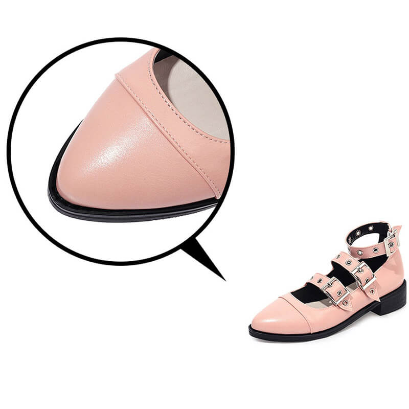 Close-up of punk style pink PU leather pumps with buckle straps, showcasing edgy alternative fashion for women.