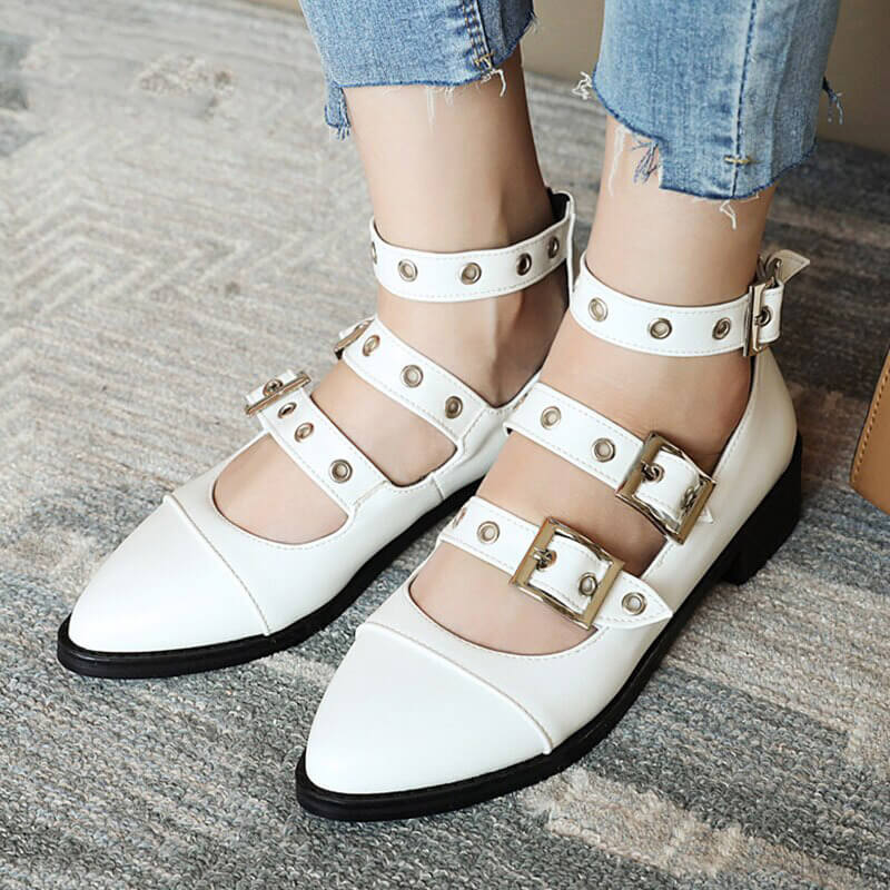 White punk style PU leather pumps with buckle straps and edgy design.