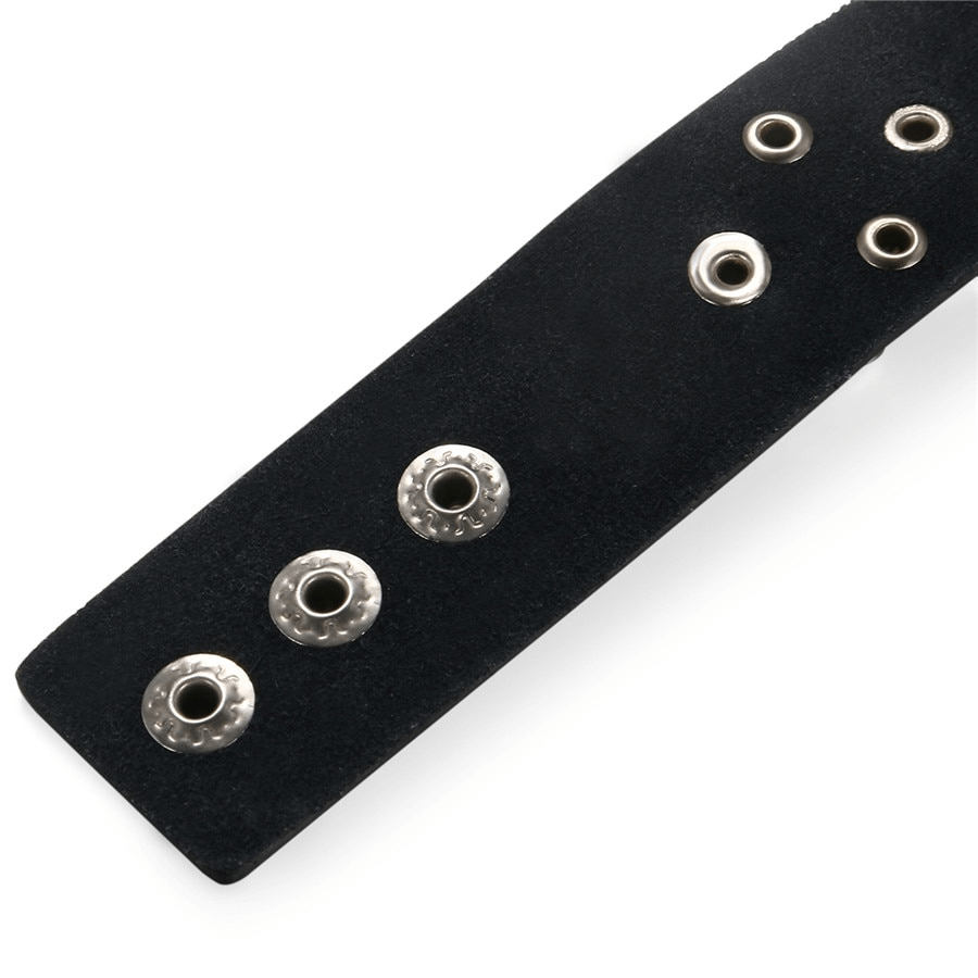 Close-up of a black suede bracelet featuring silver rivets, showcasing a punk and gothic style.