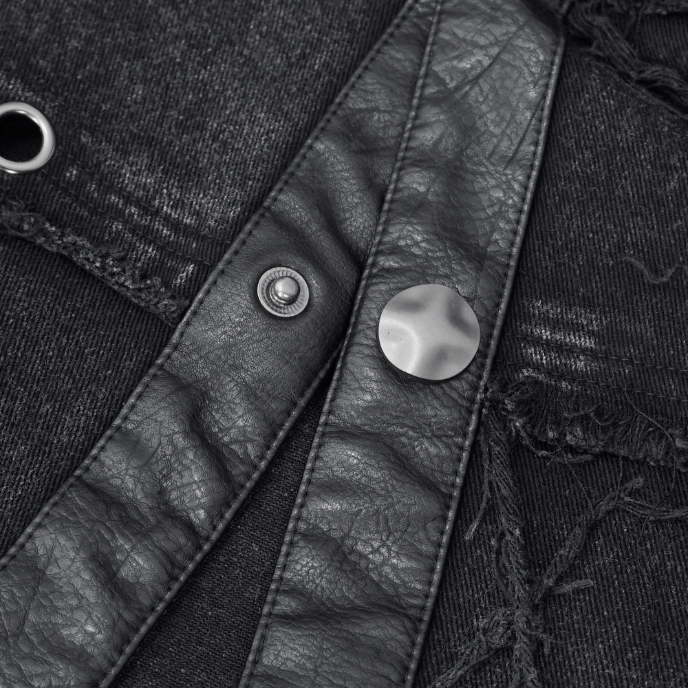 Close-up of a black studded vest showcasing rivets and distressed fabric details for punk style fashion.