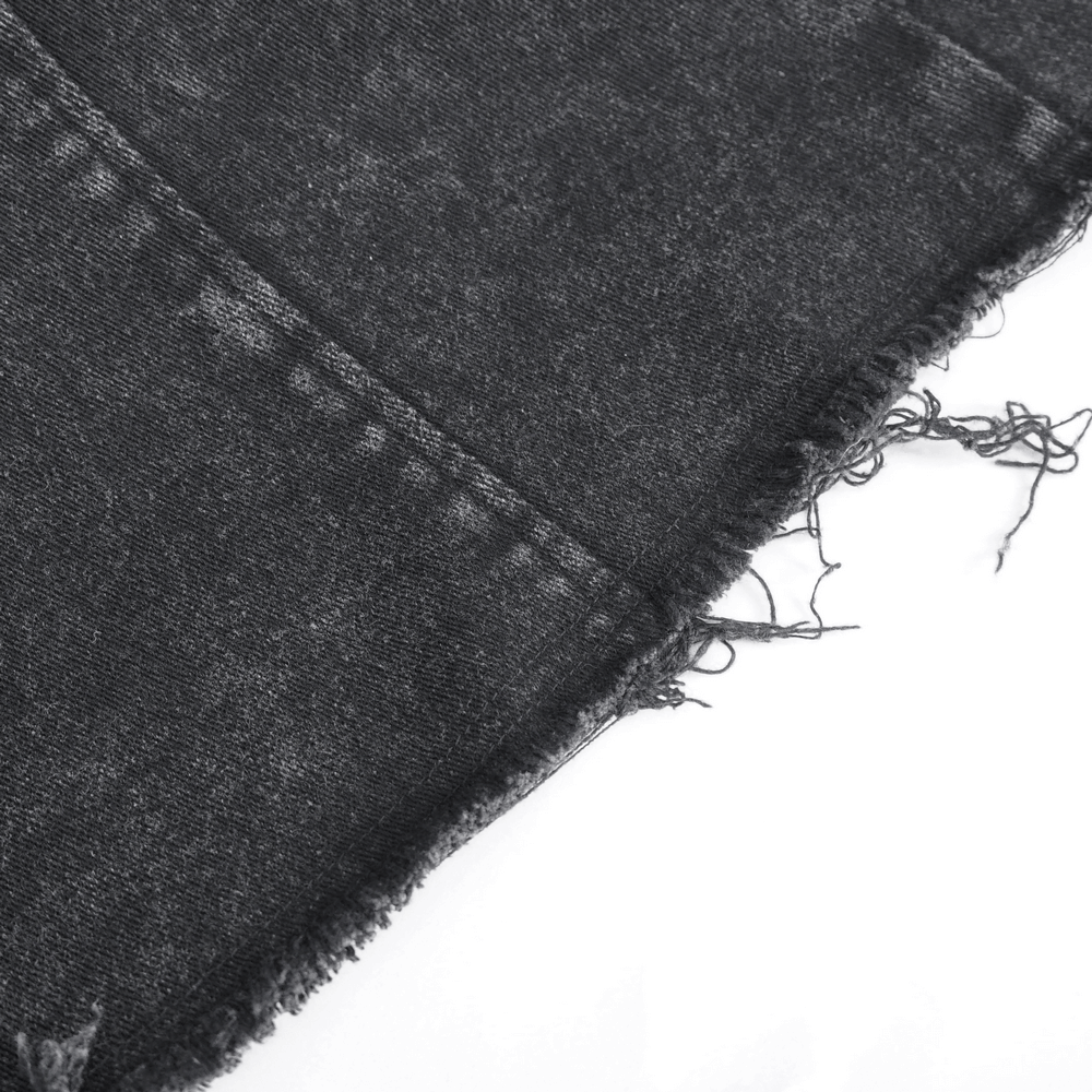 Close-up of black distressed fabric with frayed edges, perfect for a gothic punk sleeveless vest for men.