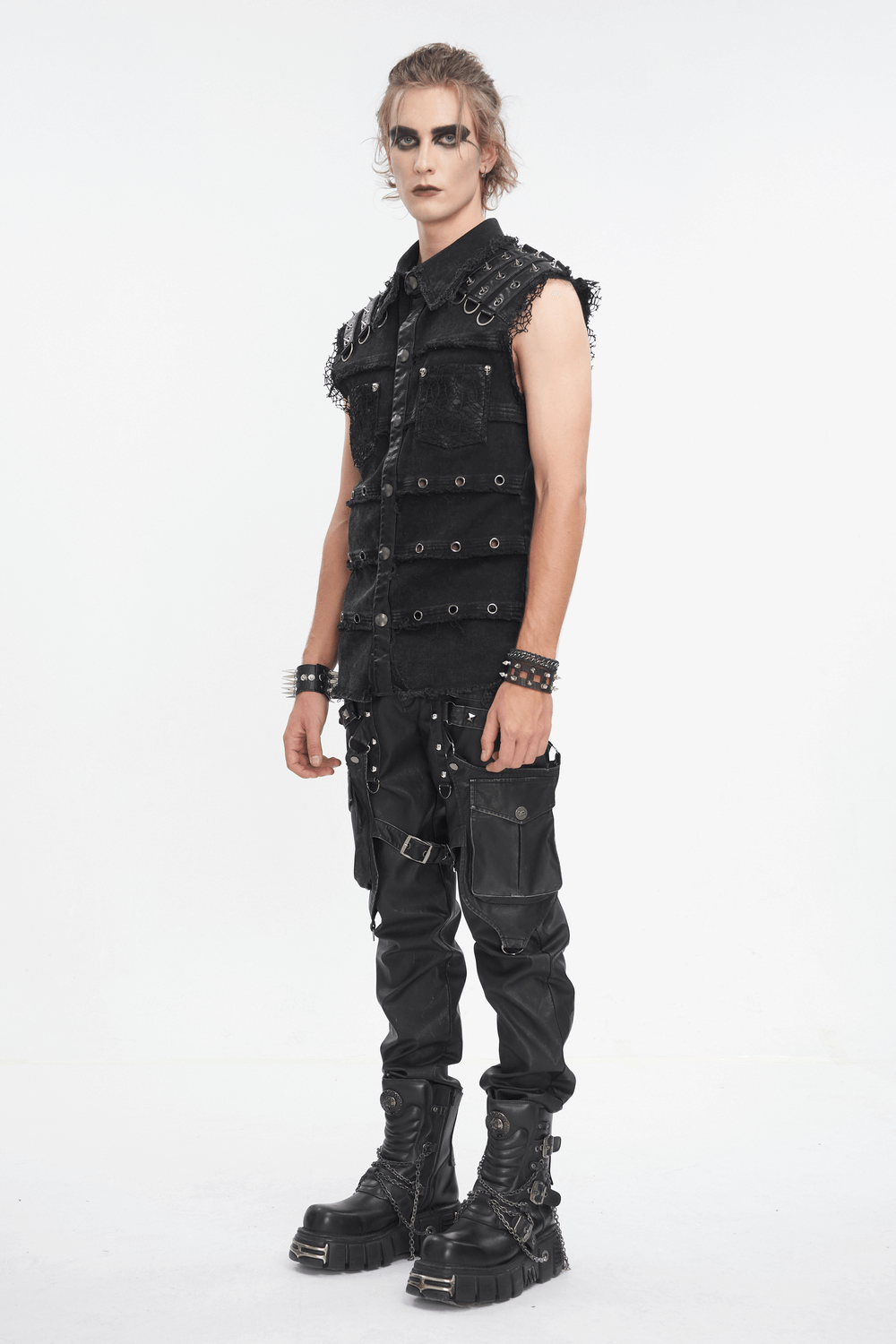 Stylish man wearing a sleeveless black studded vest, embodying punk fashion with goth elements, perfect for edgy looks.