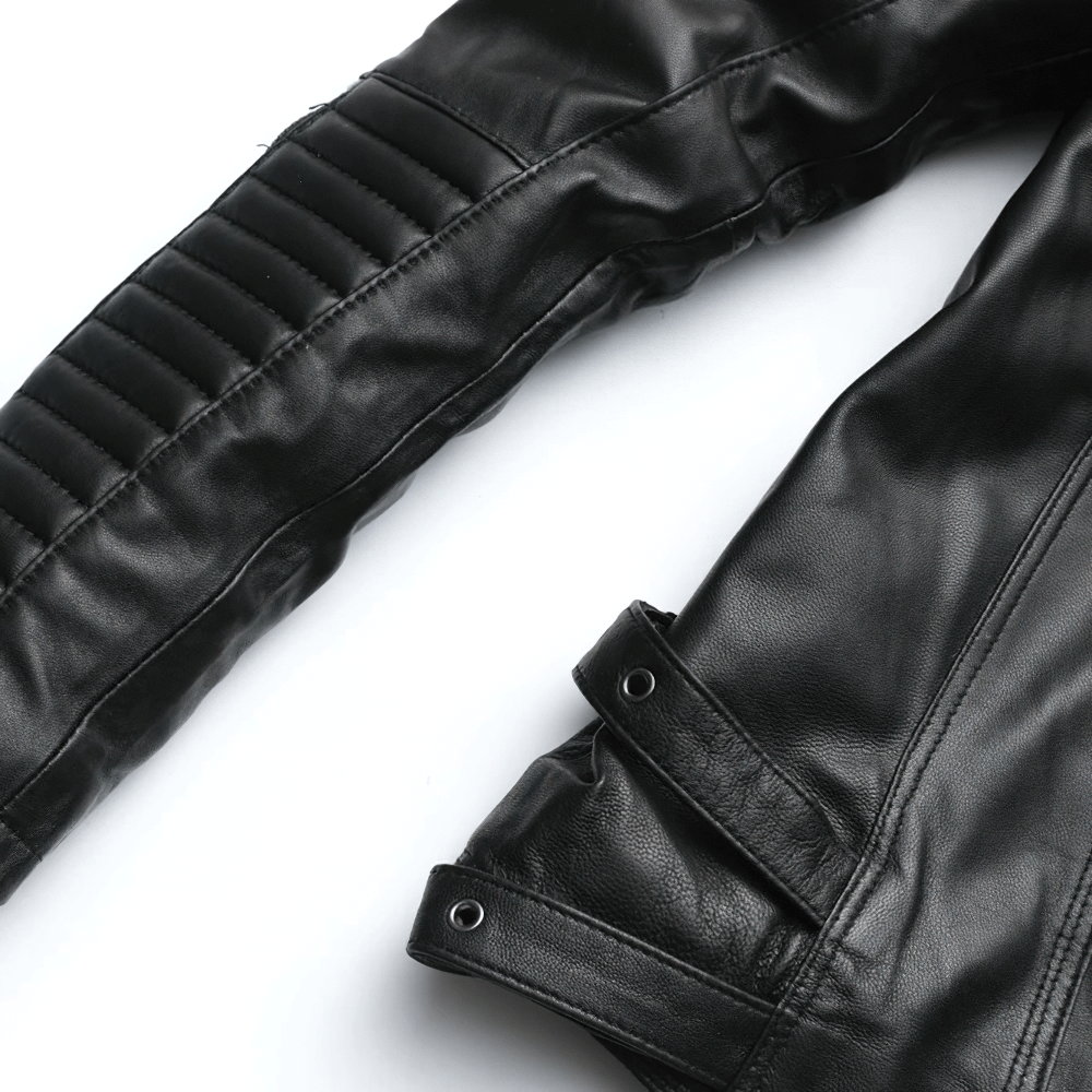 Close-up of black women's leather jacket sleeve featuring stylish zippers and quilted design for a punk rock look.