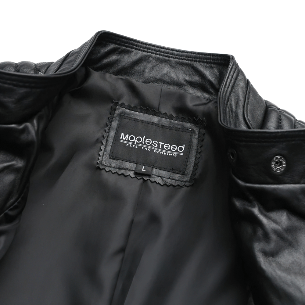 Inside view of a black women's leather jacket showing the MapleSteed label.