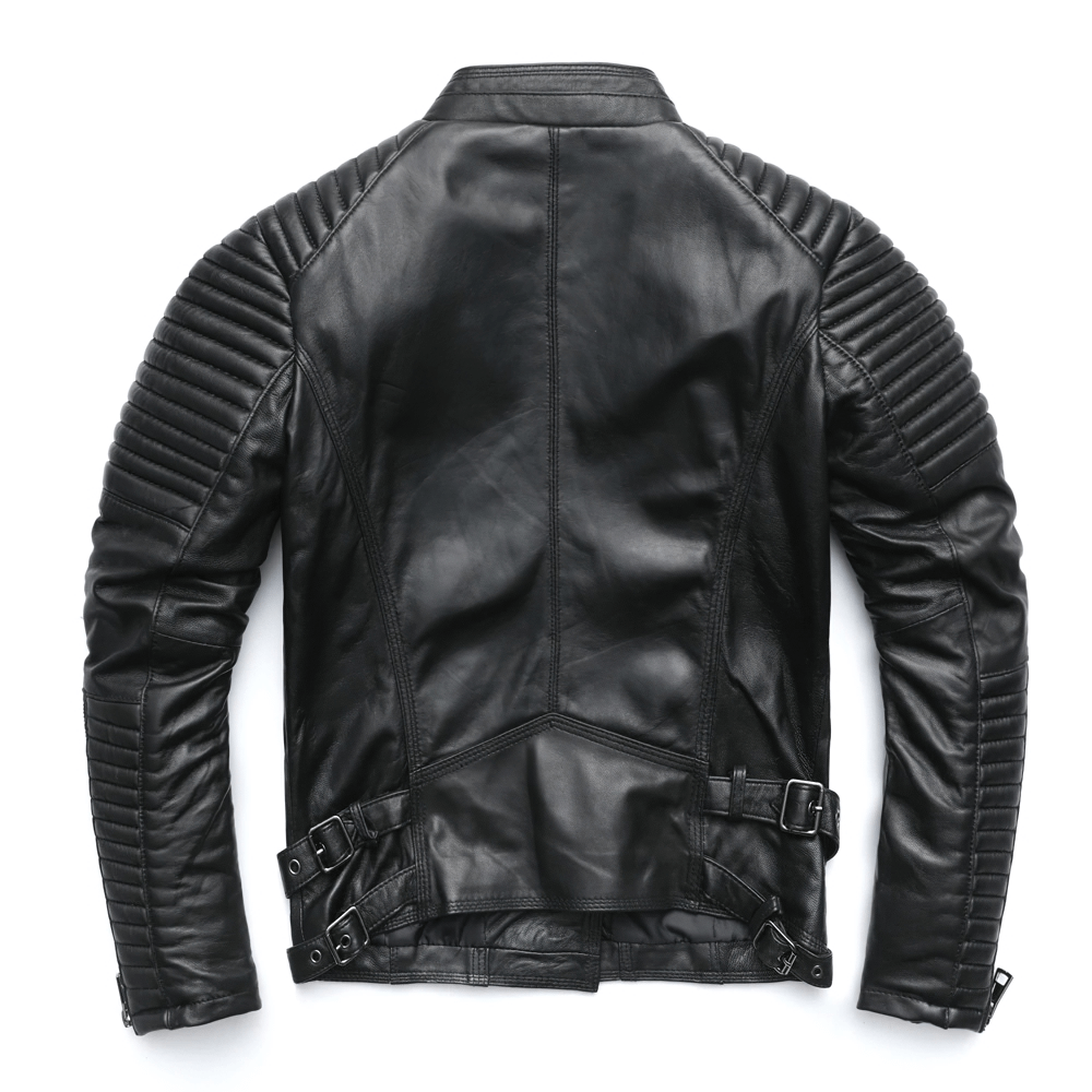 Back view of a women's punk style black leather jacket featuring silver zippers and quilted detailing.