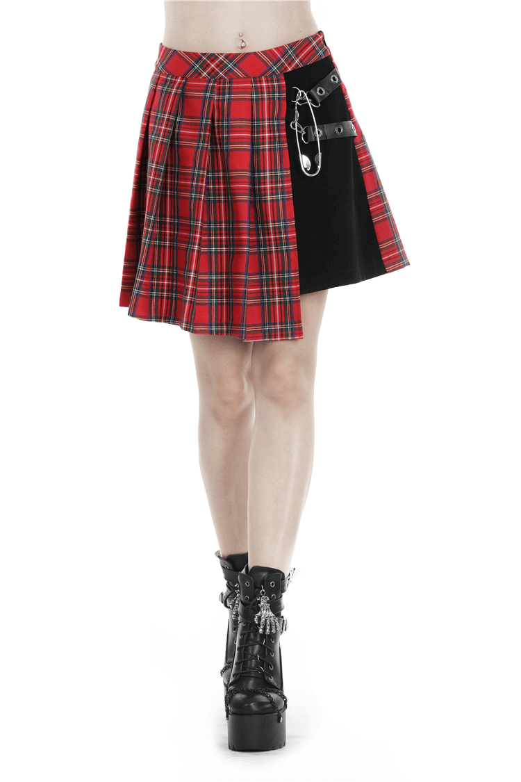 Edgy red and black plaid mini skirt with safety pin detailing, perfect for punk rock style and music festivals.
