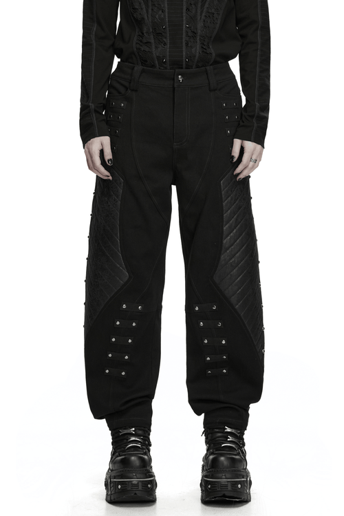 Pantalon punk fuselé avec empiècements cloutés