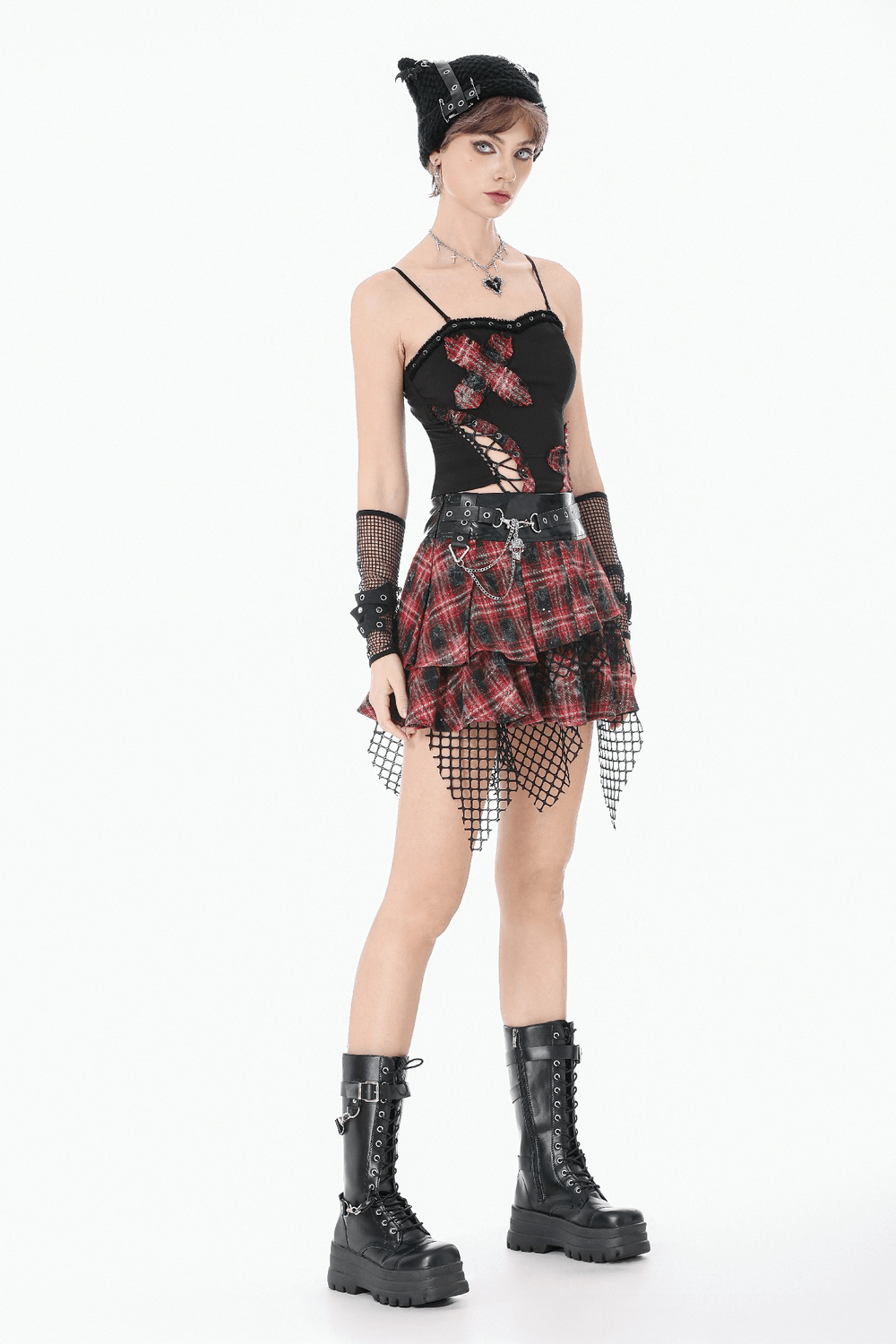 Punk Tartan Layered Mini Skirt with Chain Detail styled with fishnet hem and black boots.