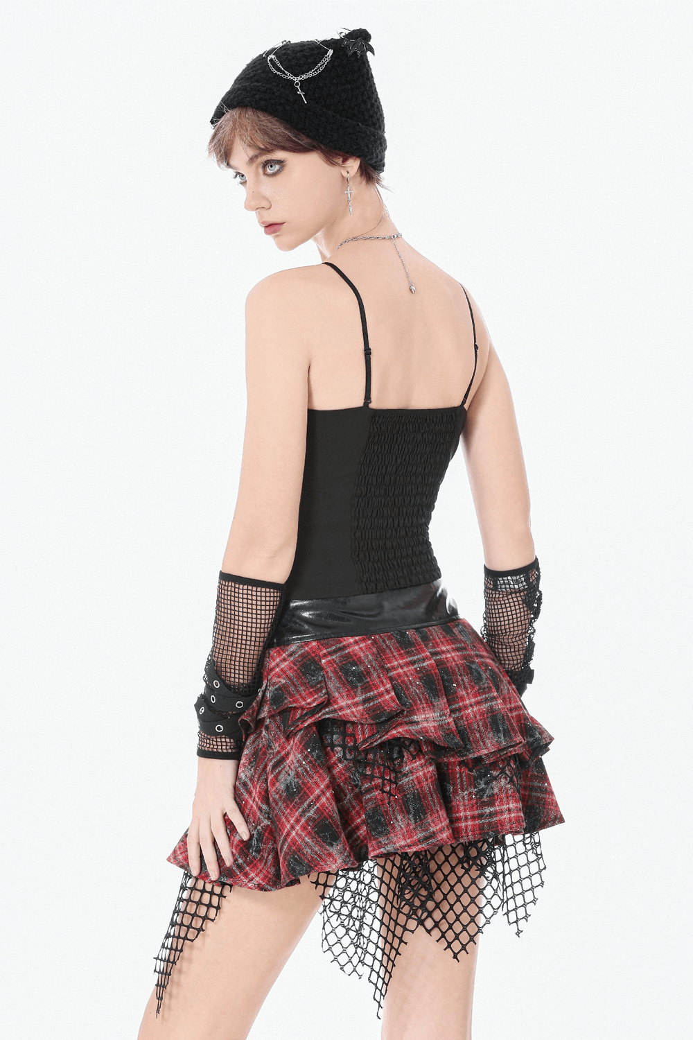 Punk Tartan Layered Mini Skirt with Chain Detail showcased on model with fishnet accessories and black top.