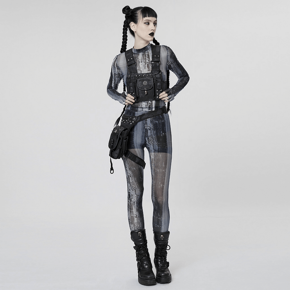 Punk techwear model in a distressed mesh longsleeve top and edgy accessories, channeling post-apocalyptic vibes.