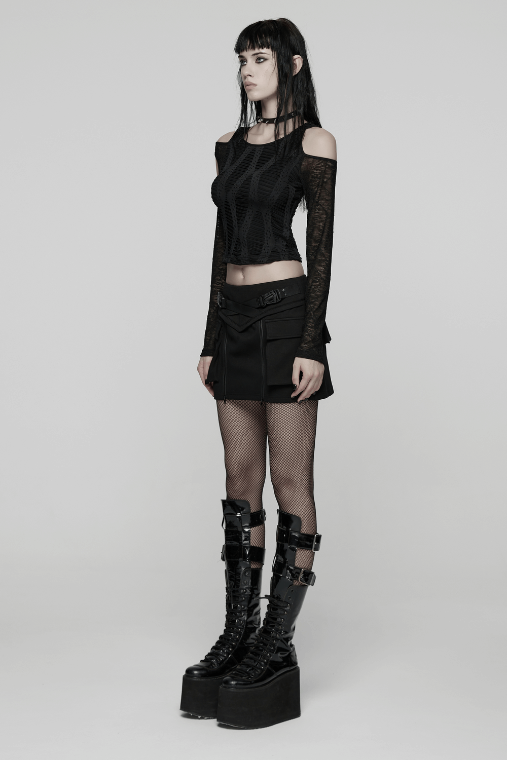 Punk Techwear Skirt with Adjustable Zippers and Pockets worn with a stylish black crop top and platform boots.