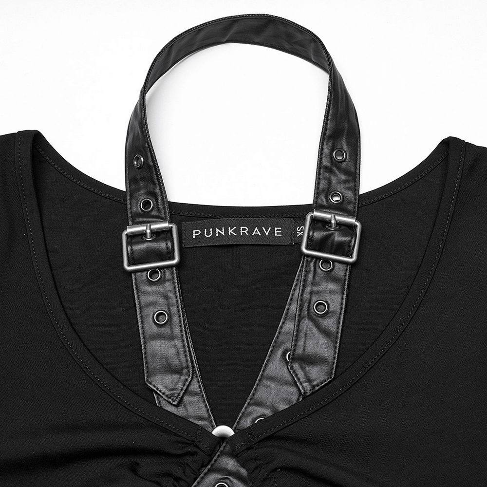 Close-up of black punk tank top with detachable faux leather straps and buckle detail.