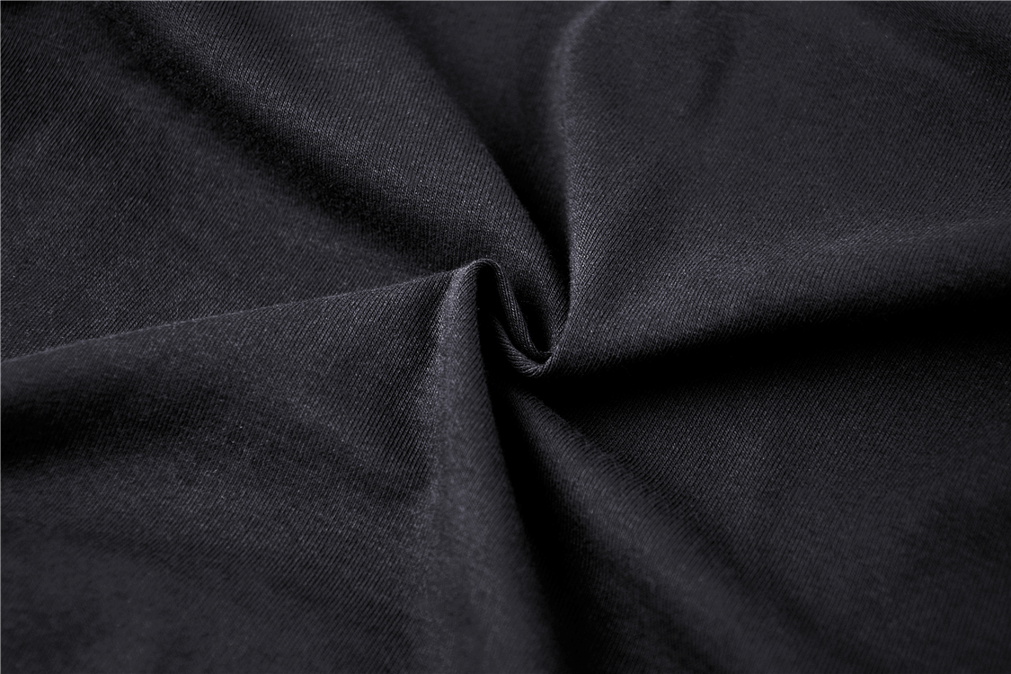 Close-up of black fabric showcasing soft texture and depth, perfect for a gothic long-sleeve top.