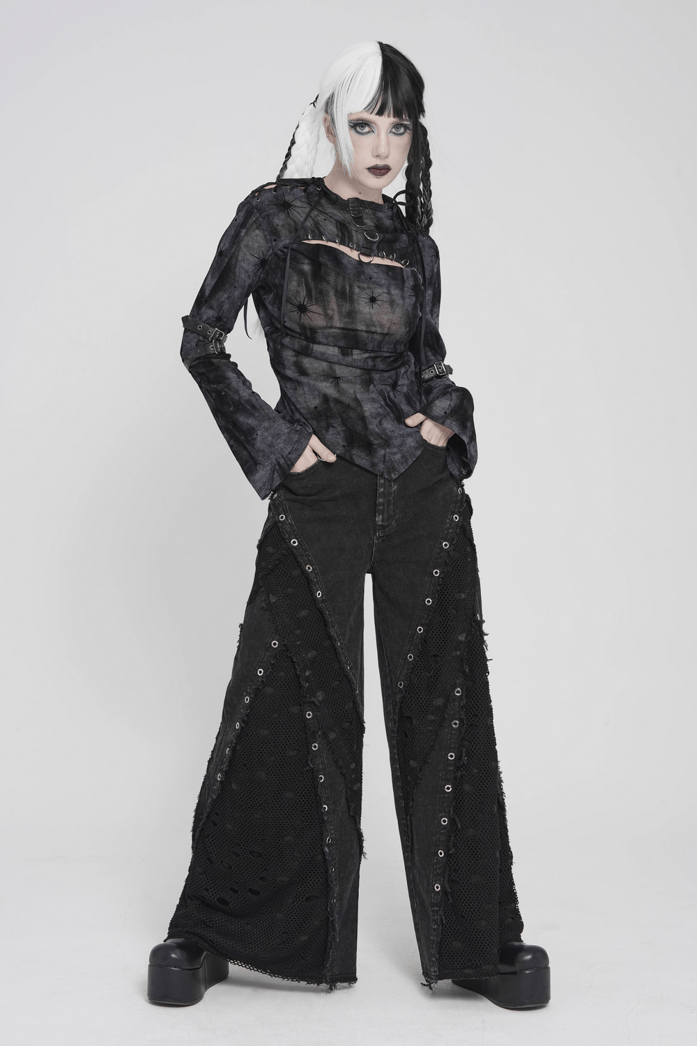 Punk Wide Leg Jeans with Distressed Mesh Panels, featuring eyelet ring details and a fierce punk silhouette.