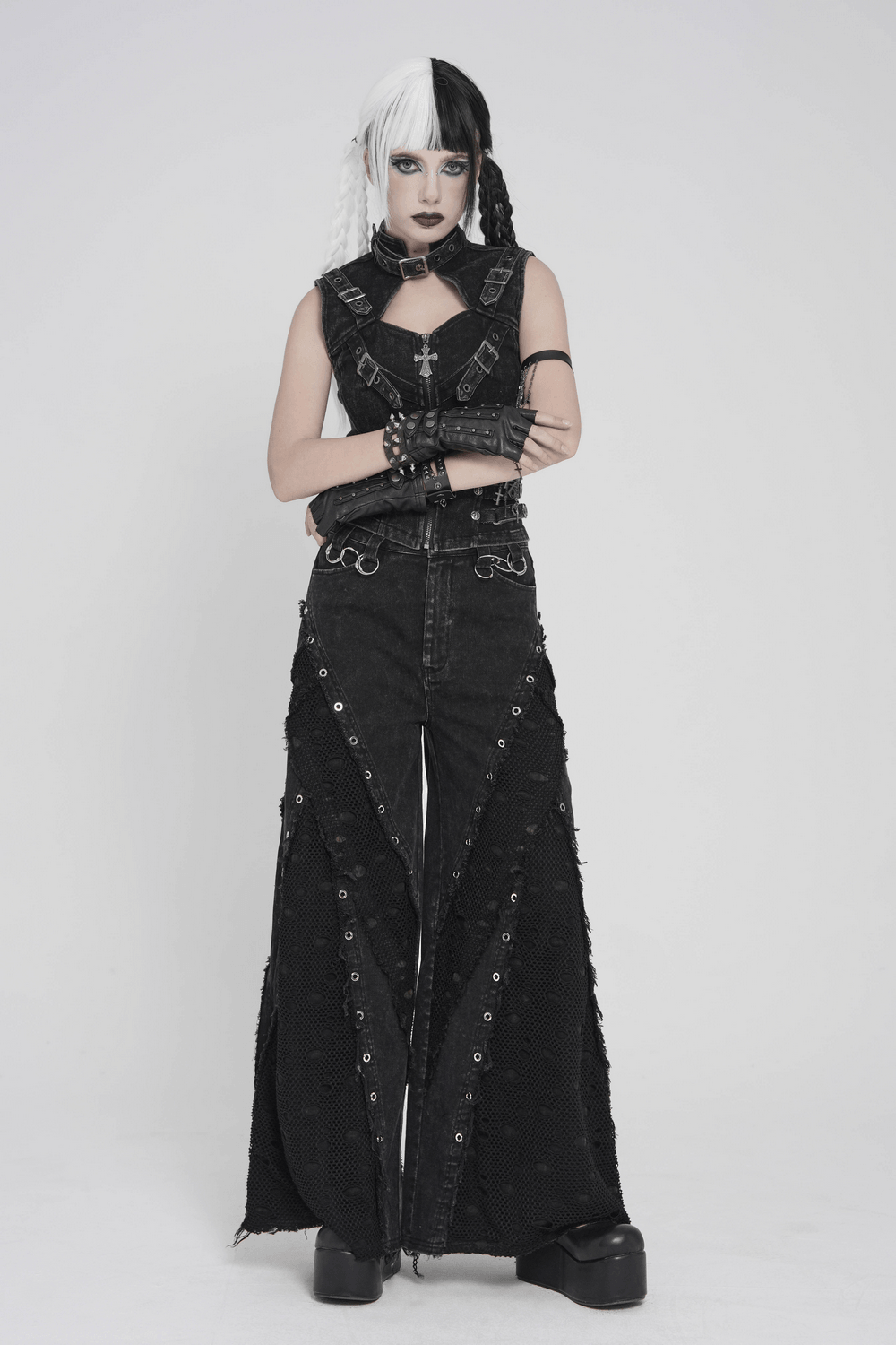 Model showcasing Punk Wide Leg Jeans with Distressed Mesh Panels, featuring gothic styling and eyelet details.