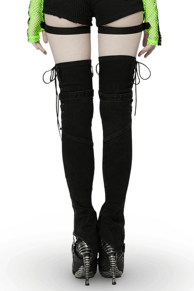 Punk women's denim claw leg warmers with drawcords, paired with stylish heels, showcasing a fierce and edgy look.
