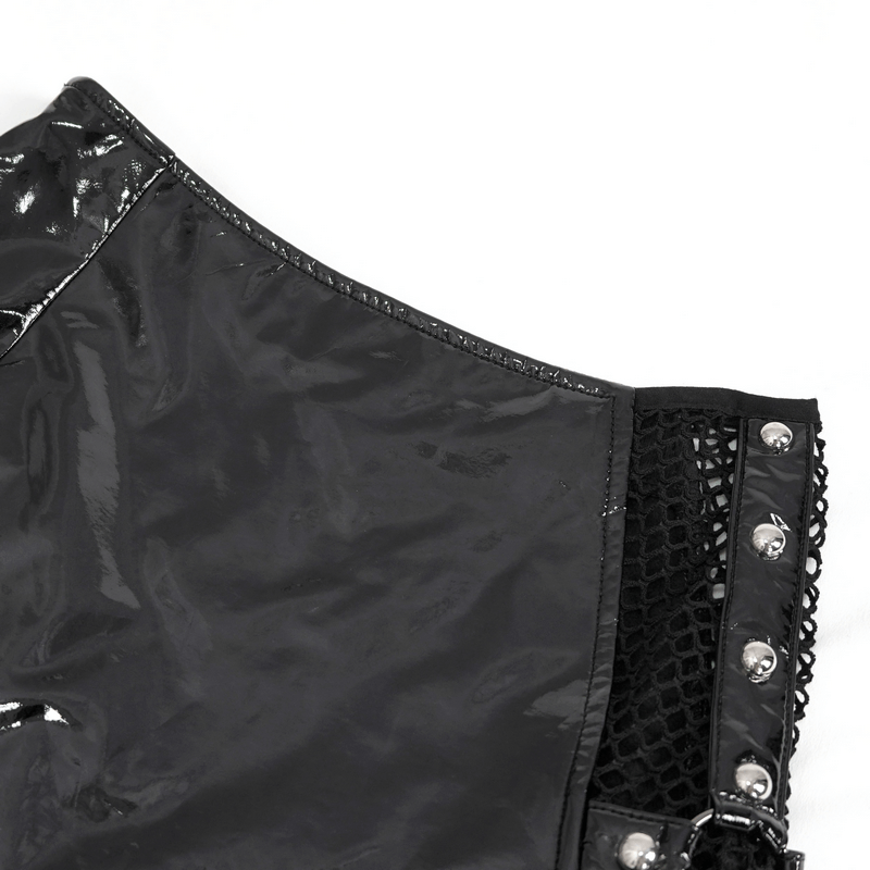 Close-up of punk women's irregular patent leather skirt with mesh detailing and metallic accents.