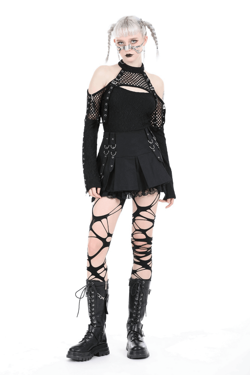 Gothic punk woman in a mini skirt with lace trim and o-rings, wearing edgy outfits and knee-high lace-up boots.