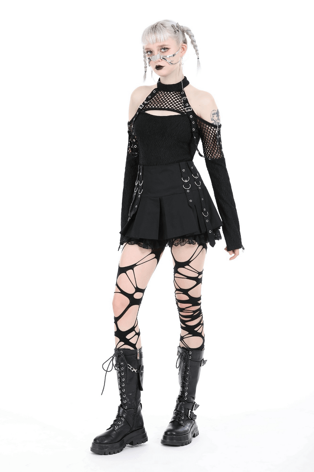 Gothic punk women's mini skirt with lace trim and O-rings, paired with edgy accessories and lace-up boots.