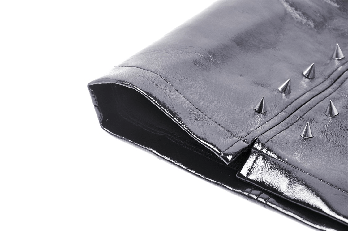 Close-up of a punk women's mini skirt featuring spikes and shiny vegan leather accents.
