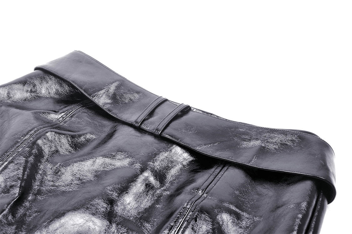 Close-up of a black vegan leather mini skirt showcasing the stylish waistband and sleek texture.