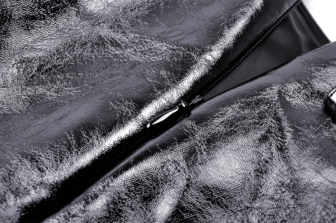 Close-up of black vegan leather with zip detail, showcasing shiny texture for a punk mini skirt.