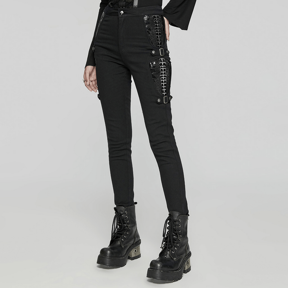 Gothic punk women's trousers with skeletons, straps, and buckles, creating a bold and edgy look.