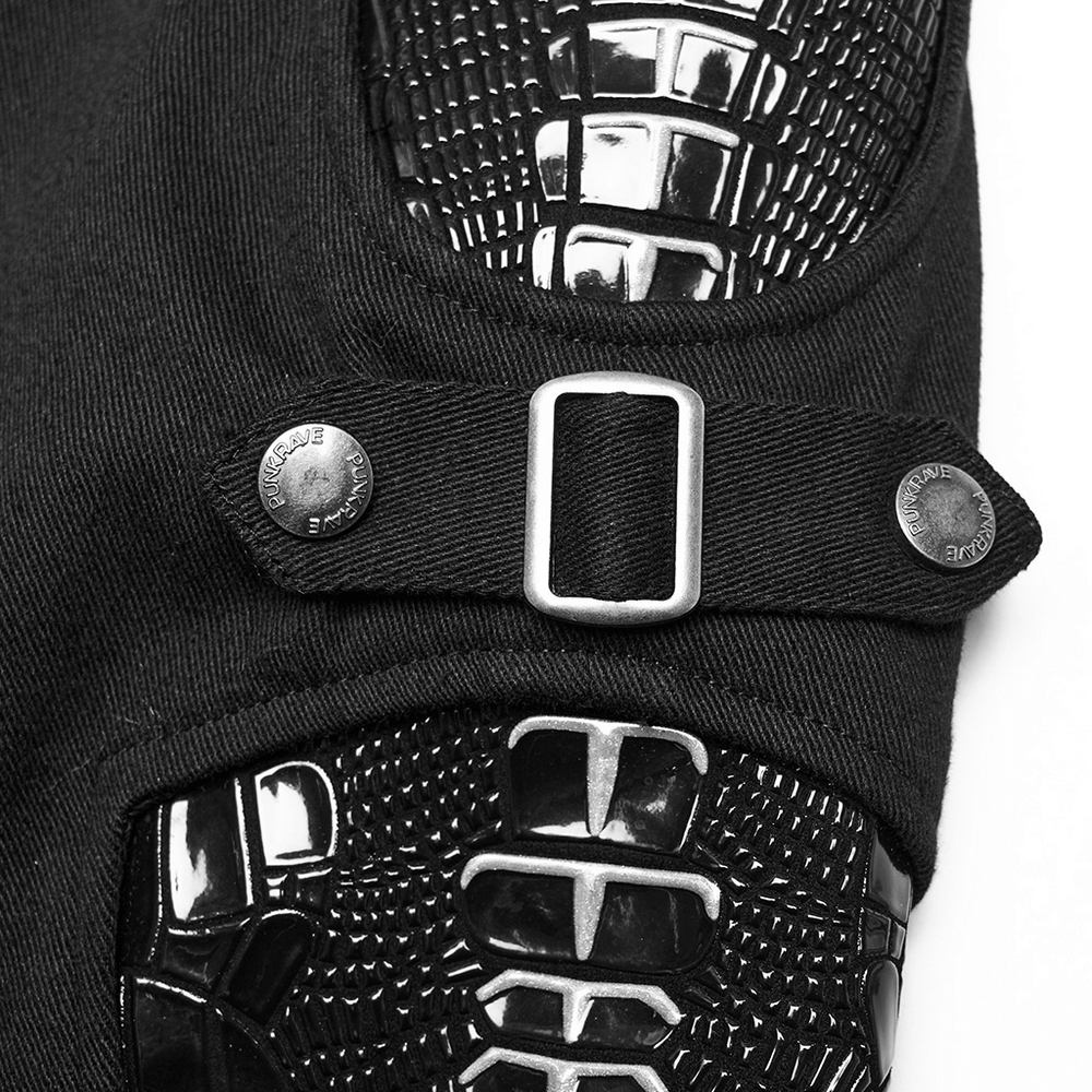 Close-up of punk women's trousers featuring patent leather skeleton design and buckle details.