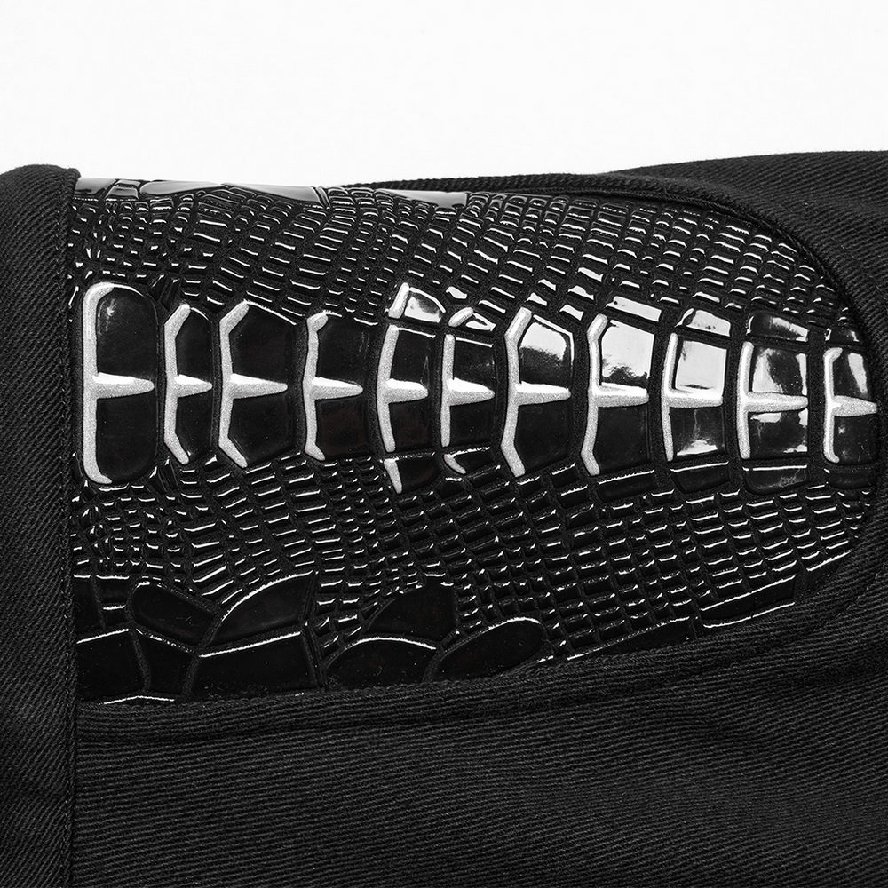 Close-up of punk women's trousers featuring glossy skeleton design and textured fabric for a bold style.