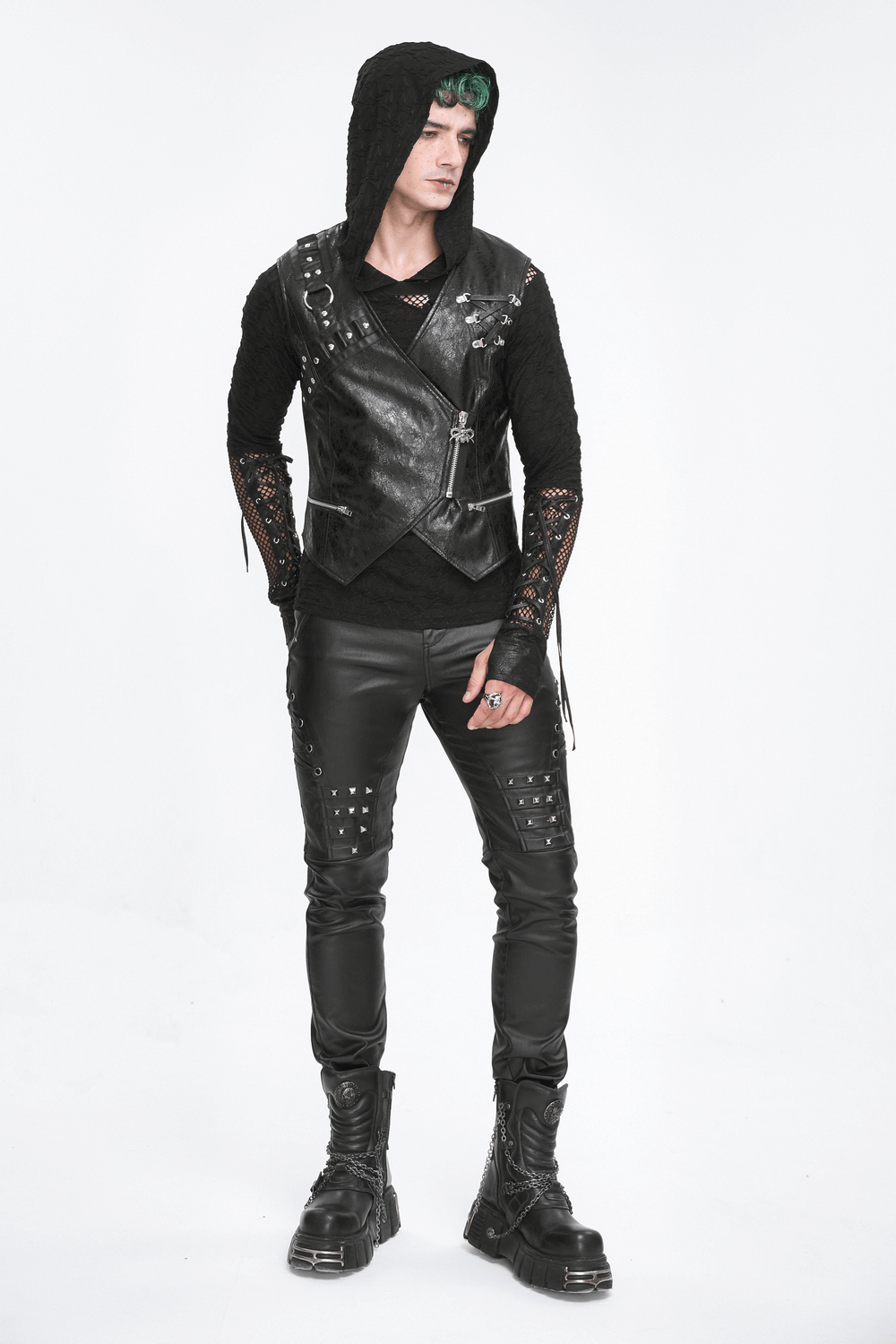 Men's punk style with a faux leather waistcoat, hooded sweater, and edgy trousers showcasing a rebellious look.