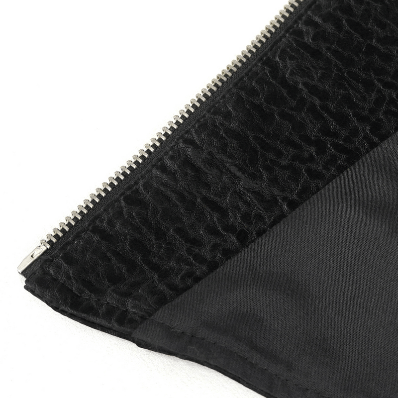 Close-up of the zipper detail on a black corset top showcasing textured fabric.