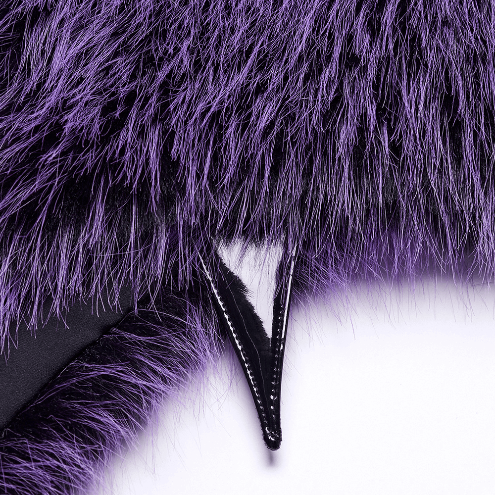 Close-up of purple faux fur capelet with horn detail and leather loop accent, showcasing its soft texture and unique design.