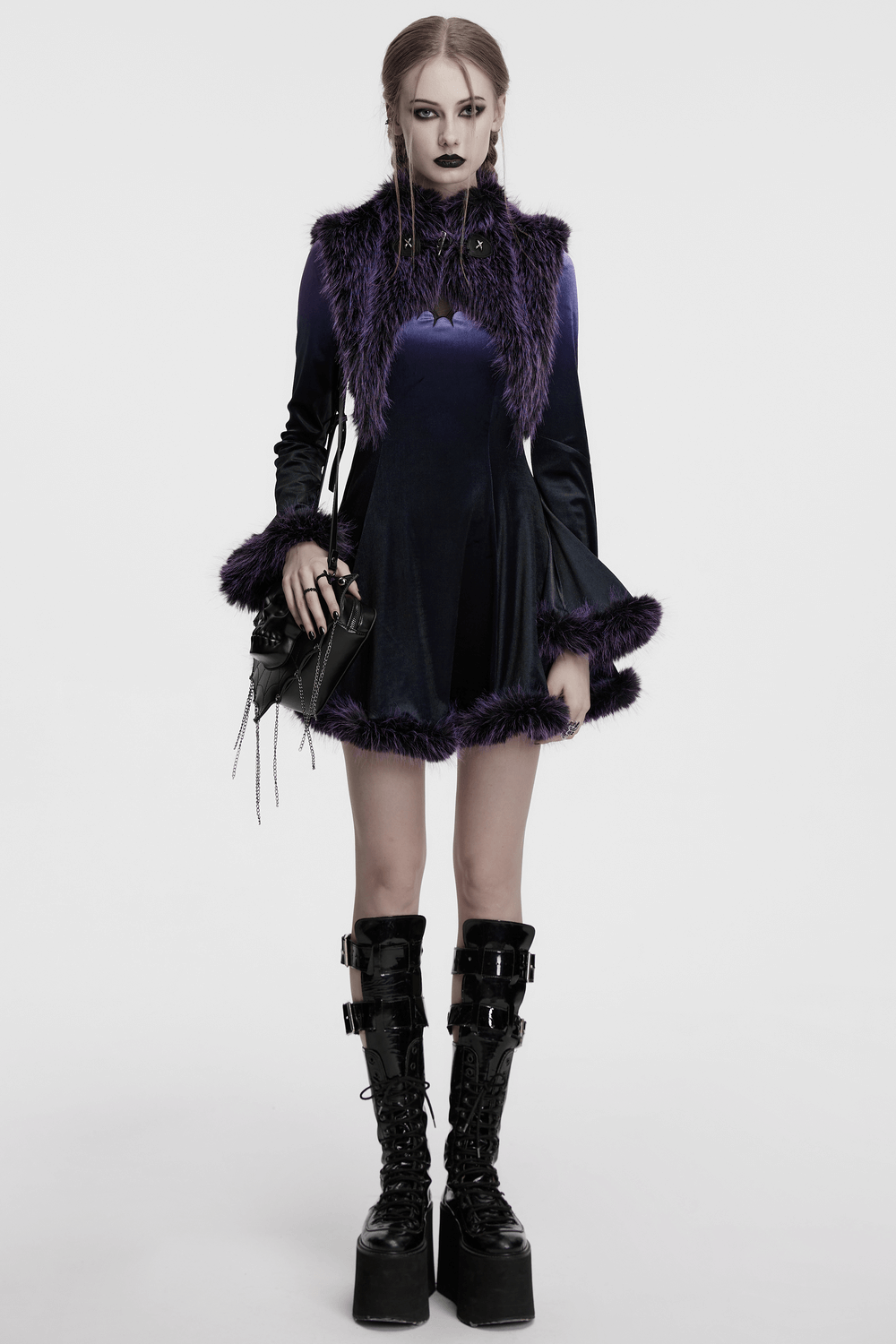 Model wearing a purple faux fur capelet with horns and a gothic dress, accentuating a bold and stylish silhouette.
