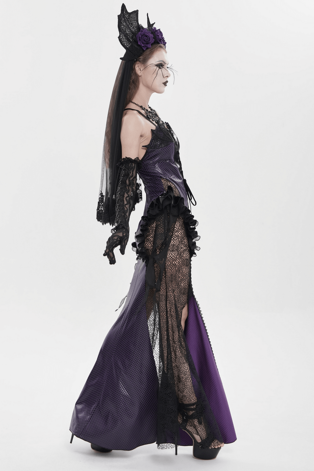 Purple Gothic Lace-Up Dress with Black Ruffle Tulle showcased on a model, featuring dramatic ruffles and lace details.