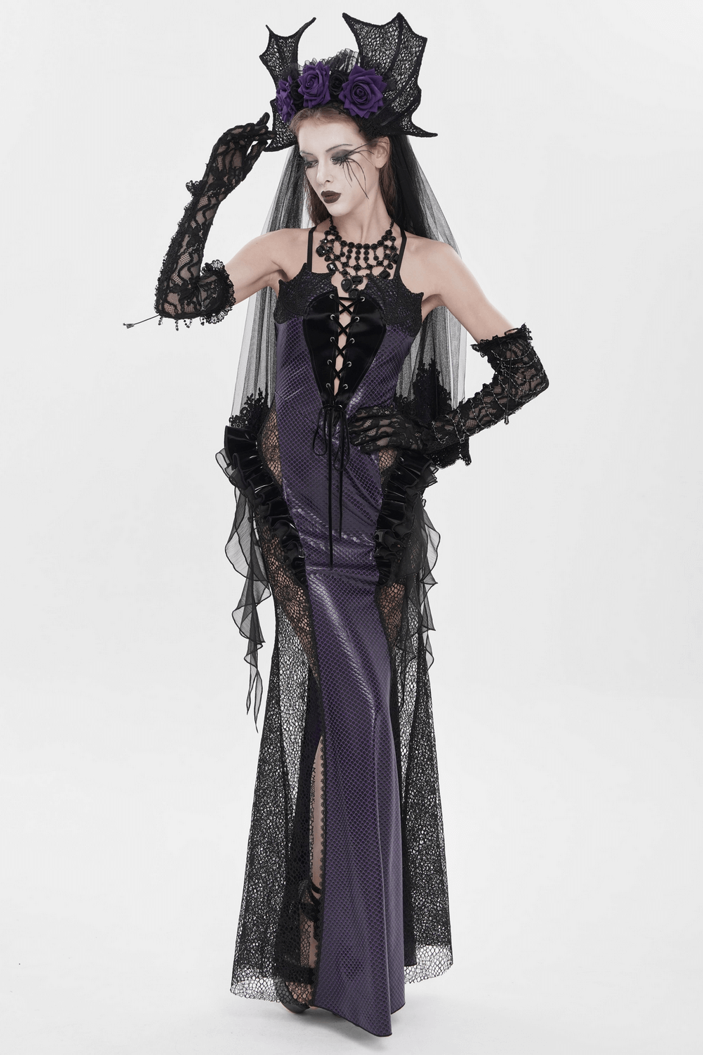 Purple Gothic Lace-Up Dress with Black Ruffle Tulle worn by model, featuring lace-up detailing and dramatic ruffles.