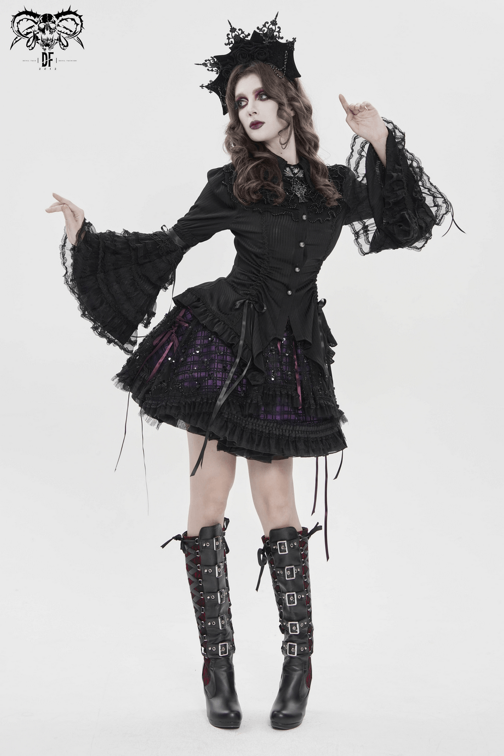 Purple Gothic Tulle Skirt with Lace Up Ribbon Trim styled with black blouse and high boots for a dramatic gothic look.
