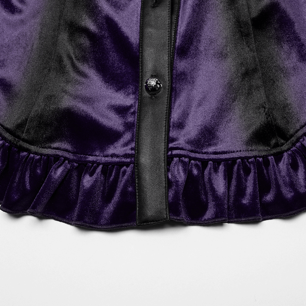 Close-up of purple gothic velvet shirt featuring ruffled hem and lace-up waist, perfect for a striking gothic look.