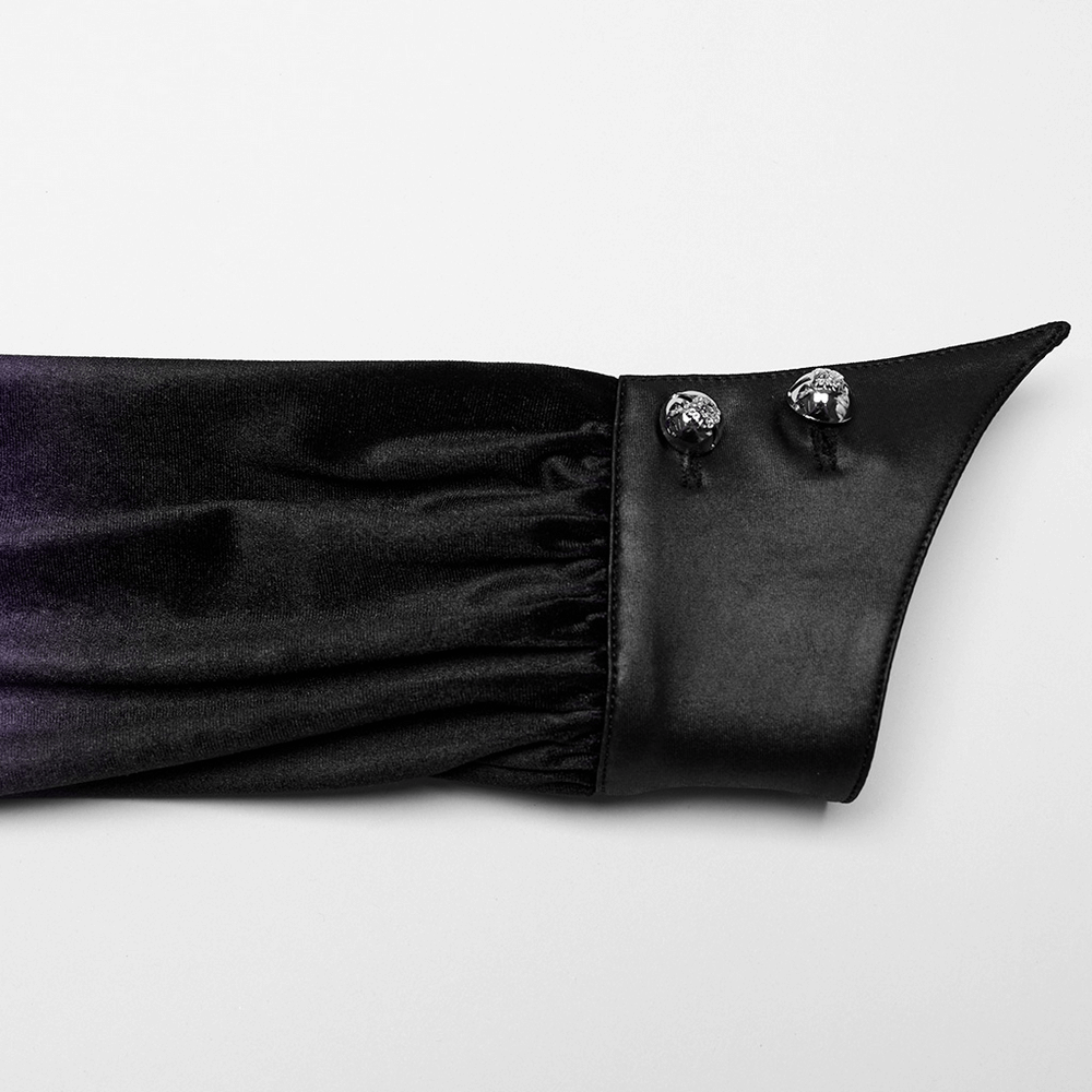Close-up of bat collar and ruffled cuffs on purple gothic velvet shirt with decorative buttons.