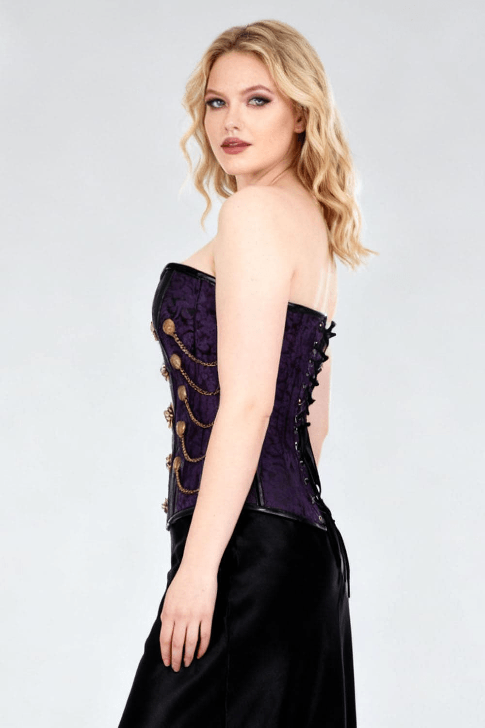 Purple Women's Overbust Corset with Statement Chain Details worn by model, showcasing the ornate design and chain accents.